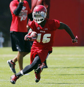 Cory Butler runs the ball during University of Utah football practice in Salt Lake City, Thursday, Aug. 6, 2015.