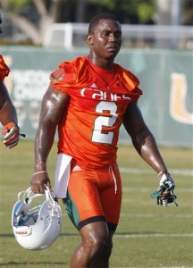 Miami running back Joseph Yearby walks on the field during the team's NCAA college football practice, Friday, Aug. 7, 2015, in Coral Gables, Fla. The team is not bothered by a national perception that they will struggle this season. (AP Photo/Joe Skipper)