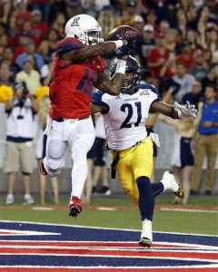 Arizona wide receiver Samajie Grant (10) catches a touchdown pass in front of Northern Arizona cornerback Delvin Batiste during the first half of an NCAA college football game, Saturday, Sept. 19, 2015, in Tucson, Ariz. (AP Photo/Rick Scuteri)