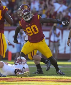 Southern California defensive end Claude Pelon, right, celebrates after Stanford quarterback Kevin Hogan was sacked during the first half of an NCAA college football game, Saturday, Sept. 19, 2015, in Los Angeles. (AP Photo/Mark J. Terrill)