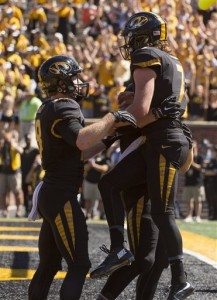 Missouri quarterback Maty Mauk, left, celebrates with teammate Wesley Leftwich, left, after Mauk scored a touchdown during the third quarter of an NCAA college football game against Connecticut, Saturday, Sept. 19, 2015, in Columbia, Mo. Missouri won the game 9-6.  (AP Photo/L.G. Patterson)
