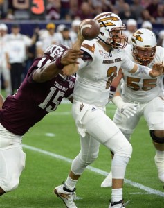 Arizona State quarterback Mike Bercovici (2) is pressured as he passes by Texas A&M defensive lineman Myles Garrett (15) during the first half of an NCAA football game on Saturday, Sept. 5, 2015, in Houston. (AP Photo/George Bridges)