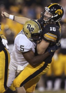 Pittsburgh defensive lineman Ejuan Price hits Iowa quarterback C.J. Beathard right after Beathard threw a pass during the first half of an NCAA college football game, Saturday, Sept. 19, 2015, in Iowa City, Iowa. (AP Photo/Justin Hayworth)