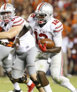 Ohio State quarterback Cardale Jones (12) breaks free for a touchdown during the second half of an NCAA college football game against Virginia Tech in Blacksburg, Va., Monday, Sept. 7, 2015. (AP Photo/Steve Helber)