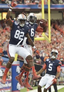 FILE - In this Sept. 5, 2015, file phtoo, Auburn quarterback Jeremy Johnson (6) celebrates his touchdown with Auburn wide receiver Melvin Ray (82) during the first half of an NCAA college football game against Louisville in Atlanta. (AP Photo/Mike Stewart, File)