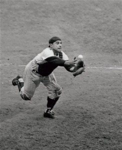 File-This Sept. 2, 1962, file photo shows catcher Yogi Berra of the New York Yankees grabbing for a foul pop bunted by pitcher Tony Pena of the Kansas City Athletics in the eighth inning of the game at New York's Yankee Stadium. Berra, the Yankees Hall of Fame catcher has died. He was 90. (AP Photo/File)