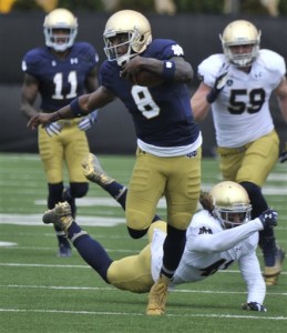 FILE - In this April 18, 2015, file photo, Notre Dame quarterback Malik Zaire (8) heads up field during the Blue Gold game in South Bend, Ind. Zaire will be Notre Dame's third starting quarterback in three years. (AP Photo/Joe Raymond)