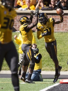 Missouri safety Ian Simon, right, celebrates with teammate Kenya Dennis, left, after Simon intercepted a pass during the third quarter of an NCAA college football game against South Carolina, Saturday, Oct. 3, 2015, in Columbia, Mo. Missouri won the game 24-10. (AP Photo/L.G. Patterson)