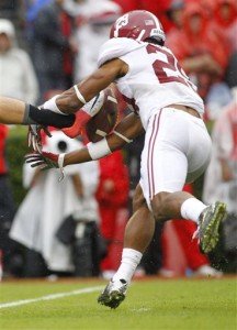 Alabama's Minkah Fitzpatrick blocks a punt by Georgia punter Collin Barber in the first half of an NCAA college football game Saturday, Oct. 3, 2015, in Athens, Ga. Alabama scored on the play. (AP Photo/Brett Davis)