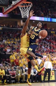 Michigan guard Derrick Walton Jr. (10) goes to the basket as he is fouled by Maryland forward Damonte Dodd (35) during the first half of an NCAA college basketball game, Sunday, Feb. 21, 2016, in College Park, Md. (AP Photo/Nick Wass)