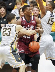 Southern Illinois' Bola Olaniyan, center, gets stripped of the ball by Wichita State's Fred VanVleet during an NCAA college basketball game Wednesday, Feb. 3, 2016, in Wichita, Kan.  (Fernando Salazar/The Wichita Eagle via AP)