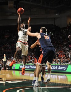 Miami's Davon Reed goes up to shoot against Virginia's Mike Toby during the first half action of an NCAA college basketball game in Coral Gables, Fla., Monday, Feb. 22, 2016. (AP Photo/Gaston De Cardenas)