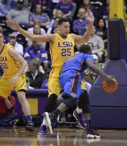 LSU forward Ben Simmons (25) defends the goal from Florida forward Dorian Finney-Smith (10) during the first half of an NCAA college basketball game in Baton Rouge, La., Saturday, Feb. 27, 2016. (Hilary Scheinuk/The Advocate via AP)