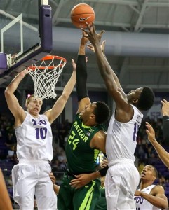 Baylor guard Ishmail Wainright (24) and TCU forward JD Miller, right, go for a rebound during the first half of an NCAA college basketball game Saturday, Feb. 27, 2016, in Fort Worth, Texas. (Steve Nurenberg/Fort Worth Star-Telegram via AP)