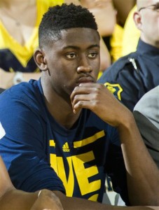 FILE - In this Feb. 6, 2016, file photo, Michigan's Caris LeVert watches from the bench in the second half of an NCAA college basketball game against Michigan State at Crisler Center in Ann Arbor, Mich. LeVert has been ruled out for the rest of the season because of a lower left leg injury, the school announced Tuesday, March 1, 2016. The 6-foot-7 LeVert has played only once in the past two months, and the Wolverines will have to compete for an NCAA Tournament spot without him.  (AP Photo/Tony Ding, File)