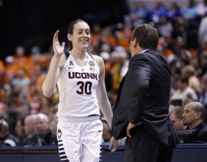 Connecticut's Breanna Stewart (30) is greeted by head coach Geno Auriemma as she is taken out of the game during the second half of a national semifinal game against Oregon State, at the women's Final Four in the NCAA college basketball tournament Sunday, April 3, 2016, in Indianapolis. Connecticut won 80-51. (AP Photo/AJ Mast)